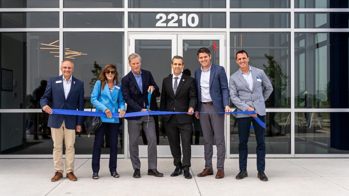 Ravago Officials Cutting Ribbon in June 2025